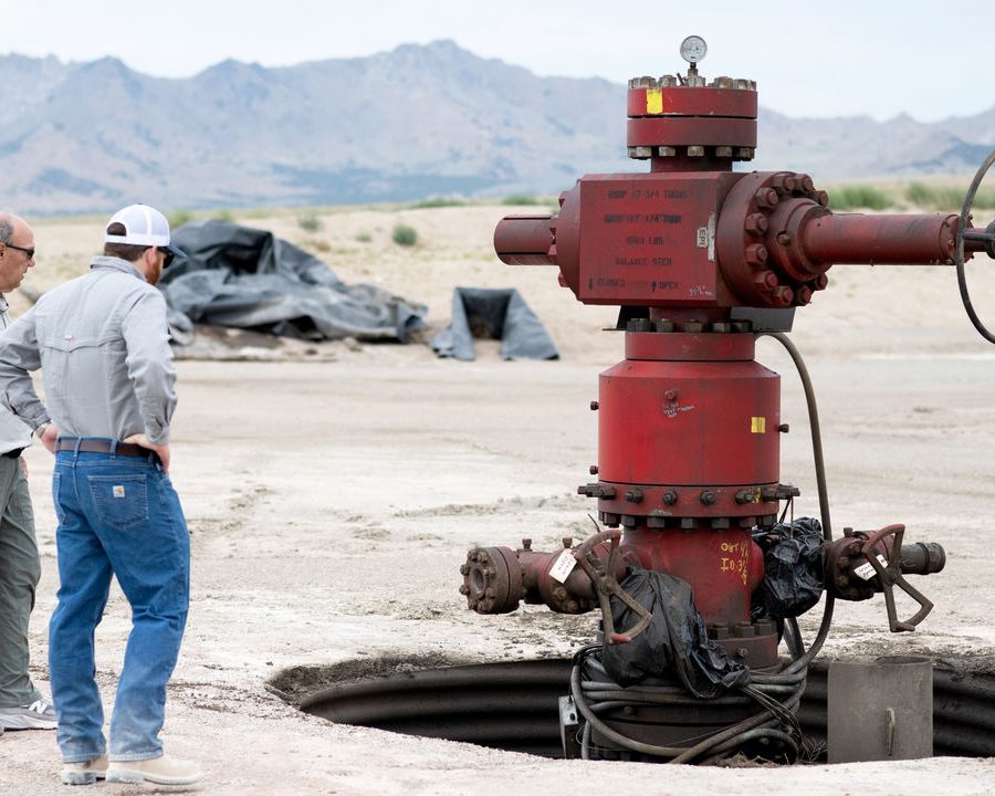 Caption : From left, geologist Joseph Moore, research professor at the University of Utah, and Tim Latimer, co-founder and CEO of Fervo Energy, exam a wellhead at the site of FORGE, a federally funded geothermal research project, outside of Milford, Utah, on July 31, 2023. There's enough geothermal energy below ground to power the entire country; some are trying to tap it -- by using techniques from the fracking boom. (Brandon Thibodeaux/The New York Times) Credit: New York Times / Redux / eyevine For further information please contact eyevine tel: +44 (0) 20 8709 8709 e-mail: info@eyevine.com www.eyevine.com